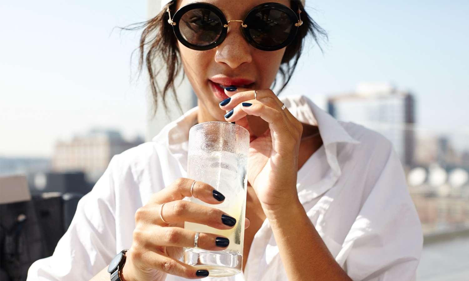 Royalton Park Avenue Hotel New York City Exterior photo A woman drinking a glass of water